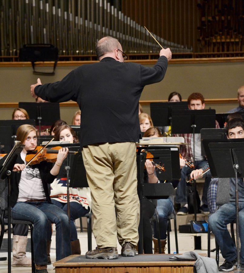 Daniel Culver, director of Augustana’s symphony orchestra, conducts the orchestra before their concert on Saturday.
Photo by Cam Best.