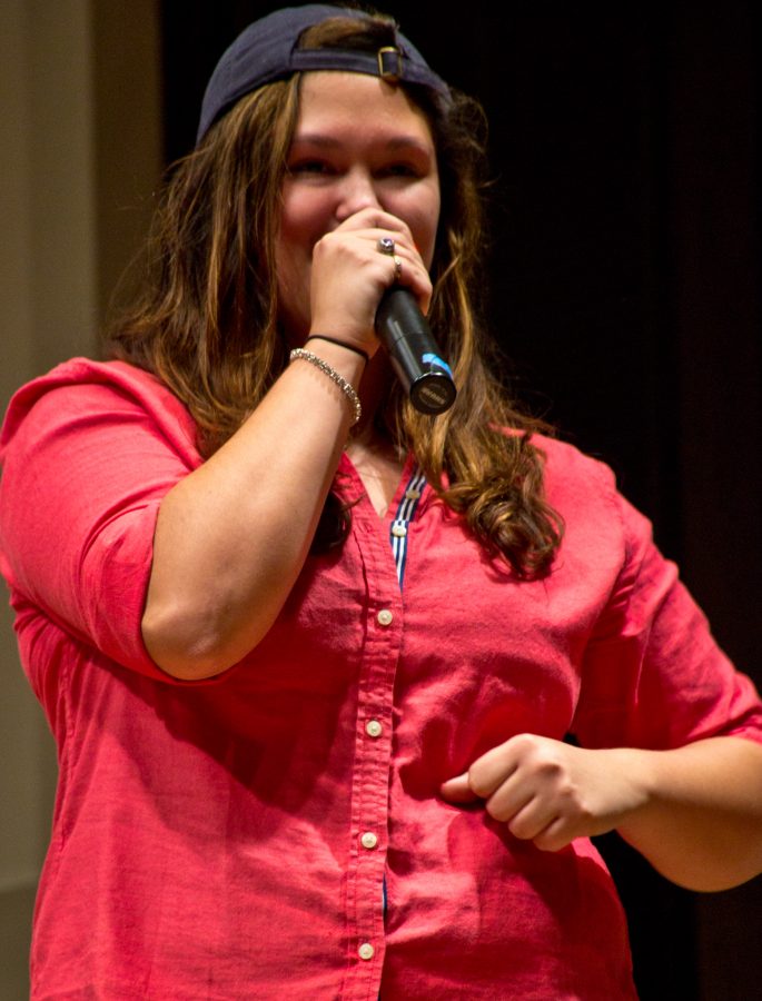 First-year Taylor Hickey performs her own rap cover using lyrics relating to Augustana. Photo by Cam Best. 