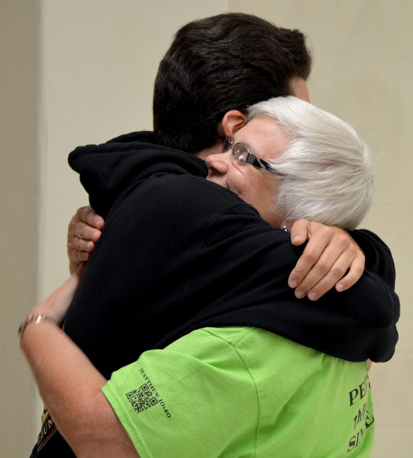 Senior John DAversa gives Sister Bobbi a hug to wish her well with her retirement from Augustana’s Catholic Ministry. Students said their good-byes to Sister Bobbi Sunday at a farewell party.