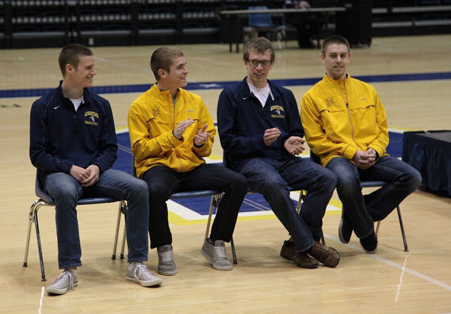 The Men’s Track and Field 1,600 relay team are recognized at a pep rally on March 24. From left: David Voland, Keith Cline, David Devore, and Isaac Smith.
Photo by Linnea Ritchie.