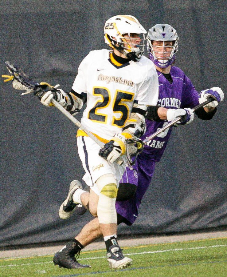 Scott Davis pushes past a Cornell College defender at their March 17 game at Thorson-Lucken Field. Augustana defeated Cornell with a 17-2 victory.
Photo by Hoang Nguyen.
