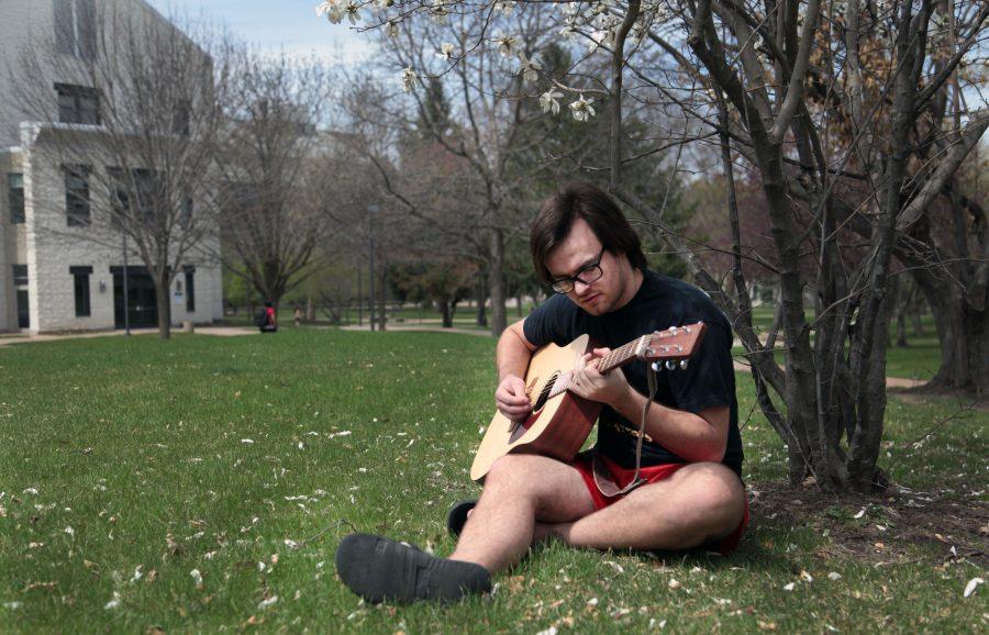 Senior Alex Schmitz plays guitar in the Quad on Tuesday along with other street performers. On April 13 and 14, students gathered in the lower quad to showcase their talents for their fellow students.
Photo by Linnea Ritchie.