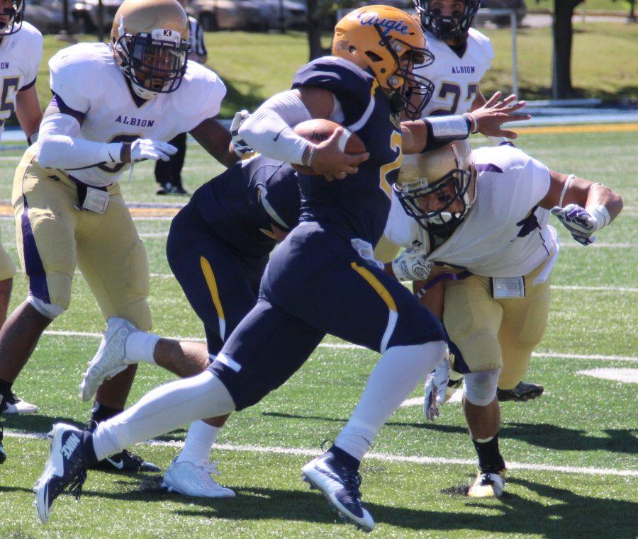 Sam Frasco runs the ball during the game against the Albion College Britons, Sat. Sept. 12. Frasco had 469 total offensive yards, breaking Ken Anderson’s school record.