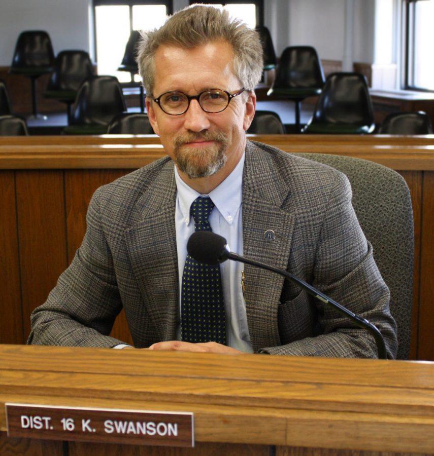 Kai Swanson, county board member representing District 16, poses at his seat in the Rock Island County Office Building. Swanson also serves as the special assistant to the president.
Photo by LuAnna Gerdemann.