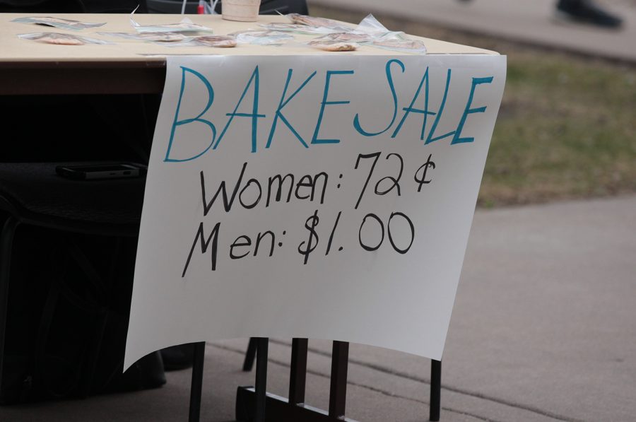 The Augustana College Democrats held a bake sale to discuss the wage gap. Their prices showed how women make $.72 on the dollar compared to their male counterparts. Photo by LuAnna Gerdemann.