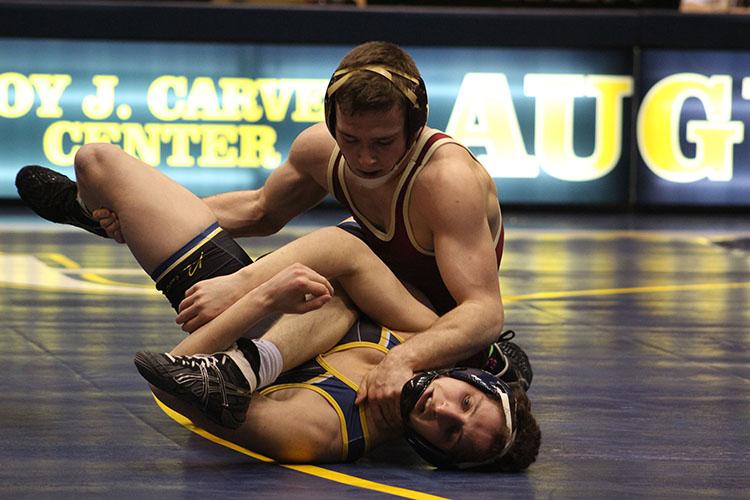 Kevin Donovan/ Observer staff
Freddy Terranova (bottom) wrestles against a Coe College opponent during the Vikings home meet last Thursday. Augustana lost to Coe 10-33. They will compete at 7 p.m. this Friday at the University of Wisconsin-Platteville.