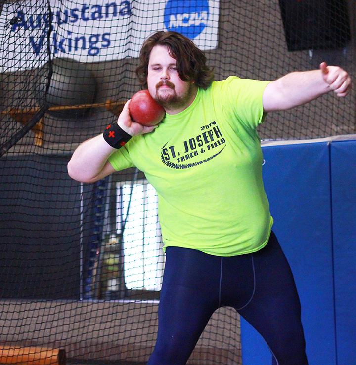 Junior Ethan Ehlers practices with a shot put before the NCAA Division III Men’s Track and Field Championships at North Central College. Ehlers finished 14th in the nation on Saturday. Photo by Tawanda Mberikwazvo.