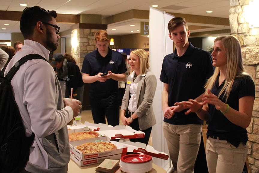 Allan Daly and Courtney Kampert speak with Kumail Hussain at the SGA Meet and Greet. Photo by Lu Gerdemann.