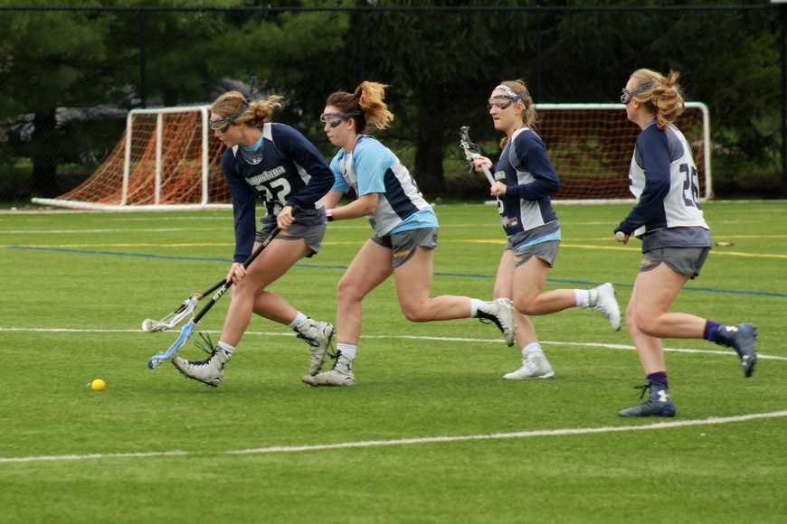 (From left to right) Sophomores Abbie Hoeg and Emily Lucnik, freshman Tracey Keane and sophomore Bailey Aasen run towards a ground ball during practice. The Vikings will be playing Colorado College Saturday and Hamline University on Sunday.  Photo by Luanna Gerdemann. 