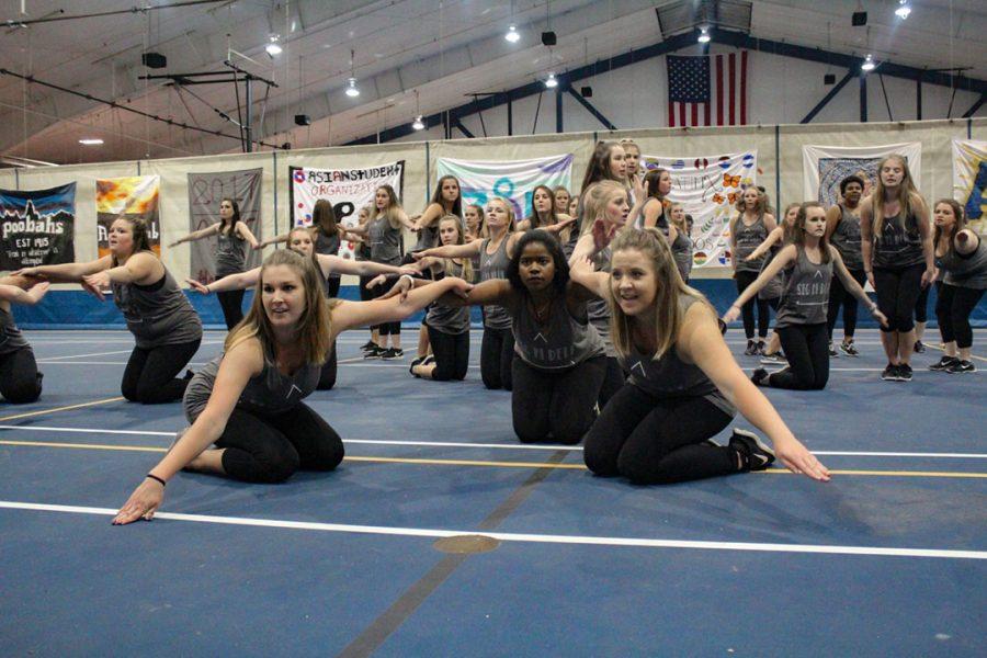 Members of the Sigma Pi Delta sorority perform their yell routine. Photo by Lu Gerdemann.