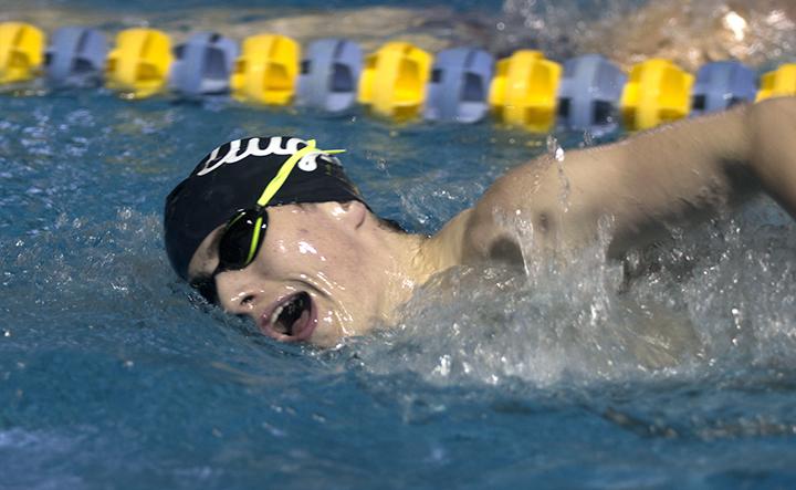 Quinn Landoch (20) swims freestyle during one of Mondays sets. Photo by Kevin Donovan