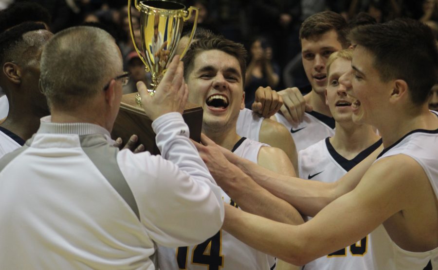 Augustana Vikings Nolan Ebel (’19) and Dylan Sortillo (’18) celebrate their win against North Central, 77-74, at the CCIW Tournament Championship on Saturday, Feb. 24, 2018. Vikings are also headed to the NCAA tournament. Photo by Maria Do.