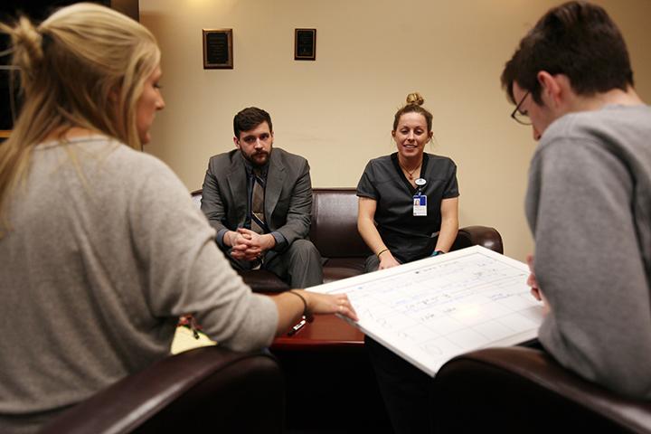 (left to right) Current Vice President Courtney Kampert, President elect Adam Gronewold, Vice President Elect Belle Hartman and current President Allan Daly meet to discuss upcoming senatorial elections and go over the transition of office. Photo by Kevin Donovan