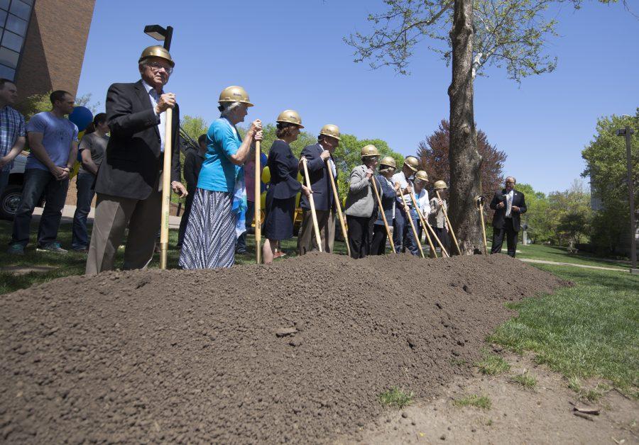 A group of donors, faculty and staff prepare to break ground in front of Hanson Hall to honor it’s upcoming expansion project, which is expected to be finished in the fall of 2019. Photo by Kevin Donovan
