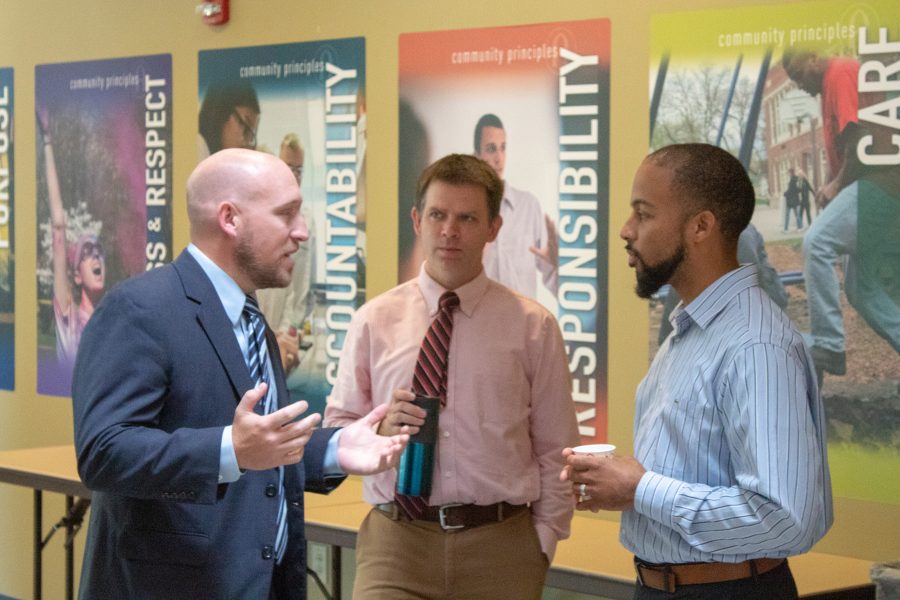 Dr. Wes Brooks (Left), Chris Beyer (Center), Michael Rogers (Right) talk in front of the Gavle rooms on Wednesday morning during a small reception to welcome Brooks, the new Dean of Students. Photo by Ian Murrin