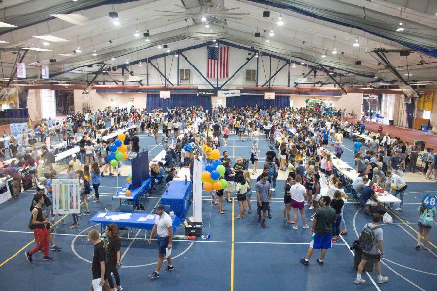 Students walk from table to table signing up for clubs and activities on campus during the Activities Fair in Pepsico on Friday, August 17. Photo by Kevin Donovan