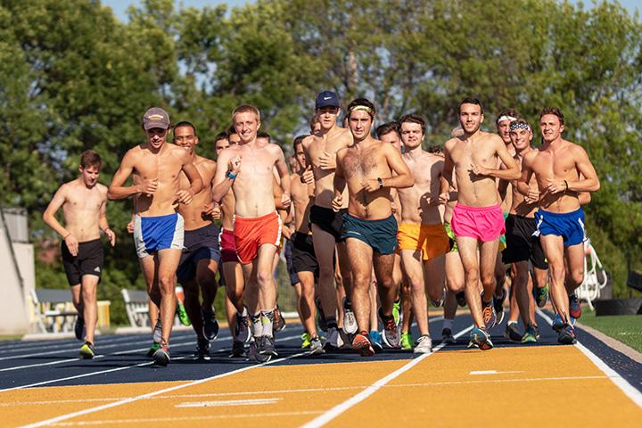 The Mens XC team does their warmup laps. Photo by Ian Murrin. 