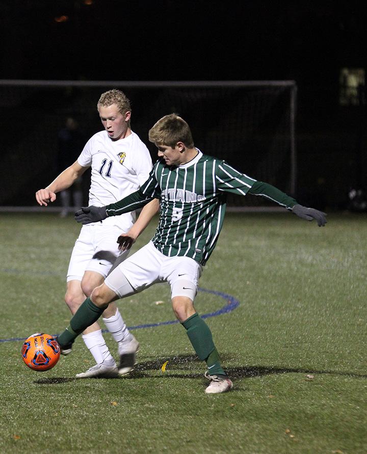 Augustana sophomore Chris Plantz  attempts to steal the ball from Luke Cangilla (#9) in their game against Illinois Wesleyan on October 10. Vikings won 1-0.