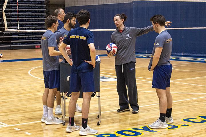 Augustana Vikings Interim Head Coach, Joshua Zolecki, coaches and speaks with the Men’s Volleyball team at their Carver Gym practice.