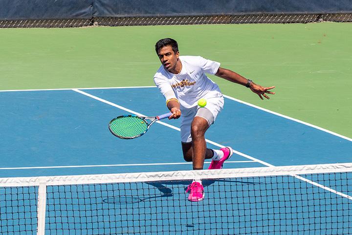 Augustana Sophomore Sriram Sugumaran, bumps the ball over the net at the Augustana Vikings match against the North Central College Cardinals at the Augustana College Tennis Courts. April 6, 2019. Photo by Ian Murrin.