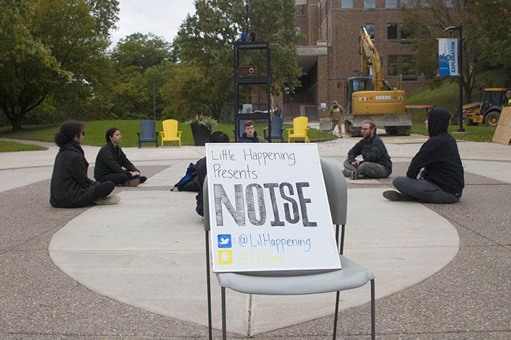 Augie senior Jonathan Quigley, Freshman Blake Traylor, and Juniors Tyler Bentley, John Cunningham, (left to right), surrounding the speakers playing random noises during the noise event organised by Little Happenings.