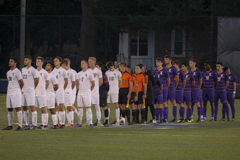 Players lining up and paying respect to the national anthem before the start of the game (Augustana vs. Knox) on Tuesday, Sept 24.