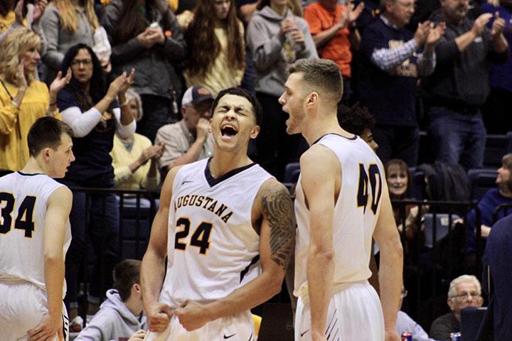 Seniors, Pierson Wofford (left) and Roman Youngblut (right) scream in happiness after their big win Senior, Micah Martin, for the Augustana Men’s Basketball team goes up for the backwards grab in their game against the Calvin Knights on November 16, 2019 in the Roy J. Carver Center for Physical Education. The Vikings won the game 70-67.