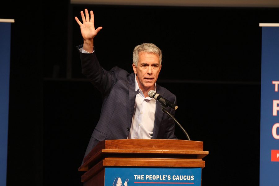 Former US Representative Joe Walsh waves to the crowd after finishing his closing statement at The Peoples Caucus forum for presidential candidates on Sunday, January 12 at Davenport North High School. Photo by Kevin Donovan