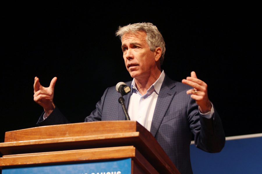 Former US Representative Joe Walsh and Republican candidate addresses a question from the panel at The Peoples Caucus forum for presidential candidates on Sunday, January 12 at Davenport North High School. Photo by Kevin Donovan