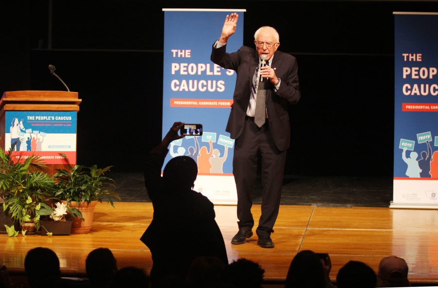 Senator Bernie Sanders waves to the crowd during the presidential candidate forum through The Peoples Caucus on Sunday, January 12 at Davenport North High School. Photo by Kevin Donovan