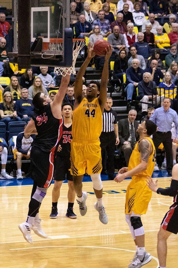 Augustana+College+senior+Micah+Martin+%28%2344%2C+right%29+reaches+the+ball+toward+the+basket+for+a+dunk+on+Carthage+College+senior+Brad+Perry+%28%2354%2C+left%29+at+the+Carver+P.E.+Center%2C+February+15%2C+2020.++The+Augustana+Vikings+won+the+game+against+the+Carthage+Red+Men+with+a+score+of+83+-+81.