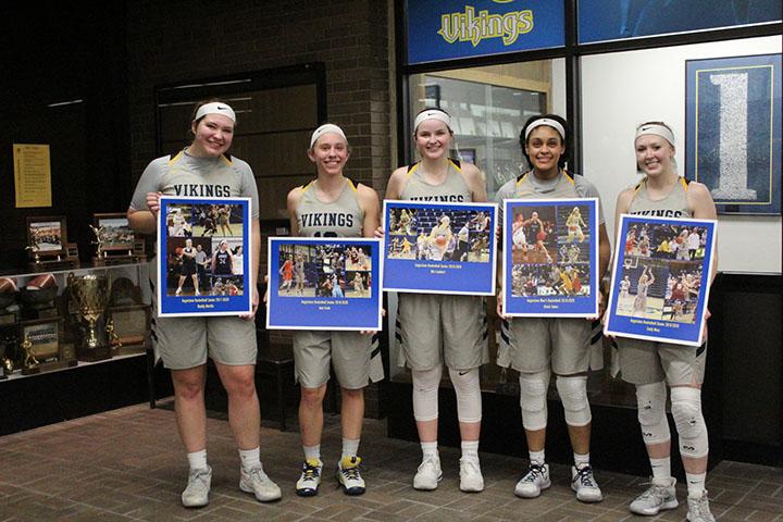 Seniors (left to right) Maddy Murillo, Jeni Crain, Mia Lambert, Alexis Jones, and Emily Ness lined up for some pictures with their photo boards after defeating North Park 62-56 at Roy J. Carver on February 22, 2020.