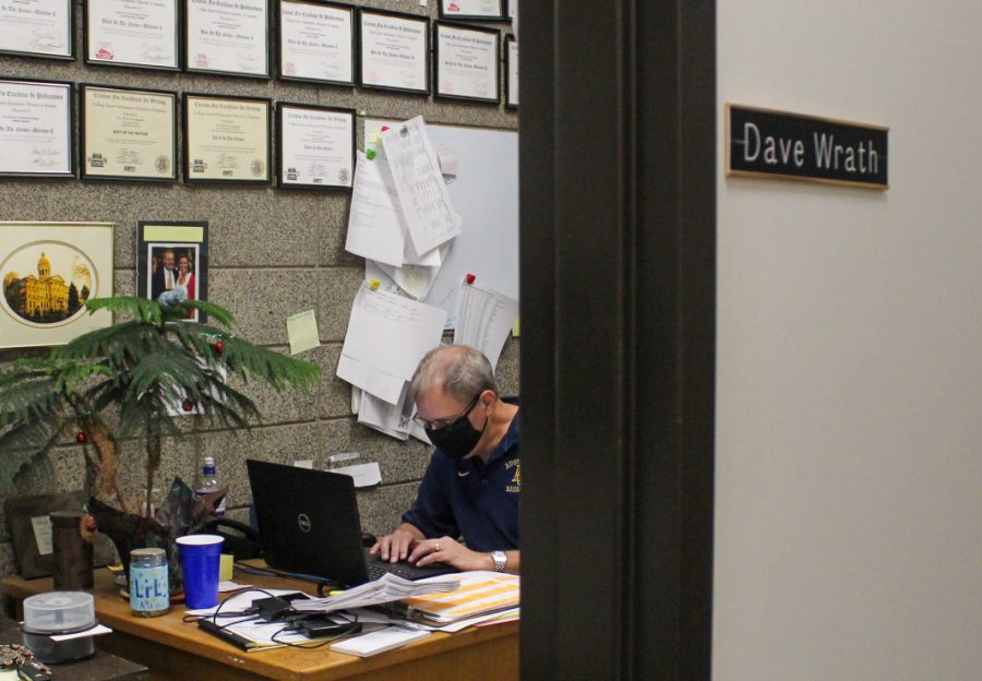 Athletic Director Dave Wrath sits in his office in the Roy J. Carver Center for Physical Education on September 4, 2020 and works on consistent changing plans for sports. Photo by Lauren Pillion
