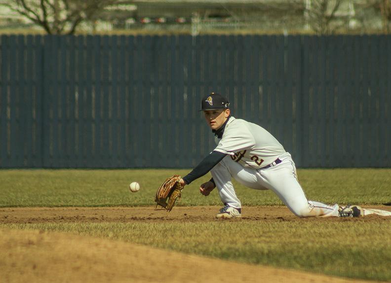 Freshman Alec McGinnis reaches for a throw from home at the Viking’s doubleheader on Thursday, March 11, 2021, vs. Cornell at Brunner Field.