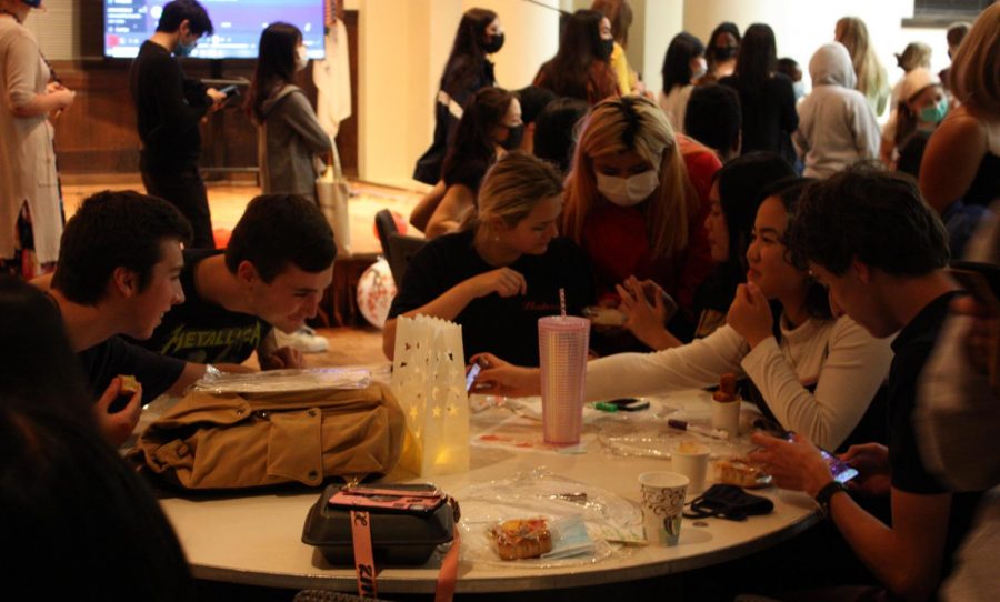 A group of students enjoy the food and atmosphere at the Moonlight Festival in Wallenberg Hall on Friday, Sept. 24.