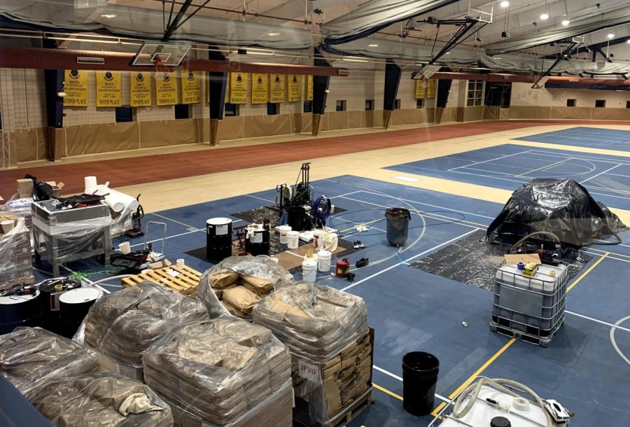 Covered walls, empty field house and new flooring materials in PepsiCo Recreation Center on Monday April 25