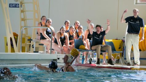 Head Coach Ryan Pryor, Assistant Coach Peter Ollis and the rest of the Augustana College Women Water Polo team react to Sophomore Annie Opal Dickson tackles Austin College’s Senior Aubrey Pasky.