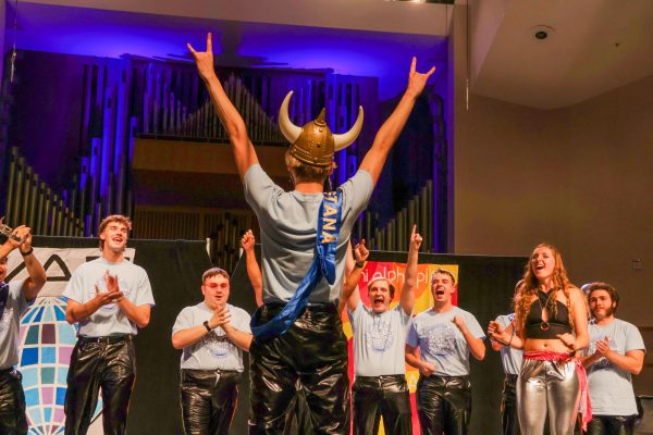 Sophomore Kaden Micklos celebrates his victory with other contestants and host Brianna Ebenroth at the annual Mr. Augustana mock pageant on
Oct. 15, 2023, in Centennial Hall.