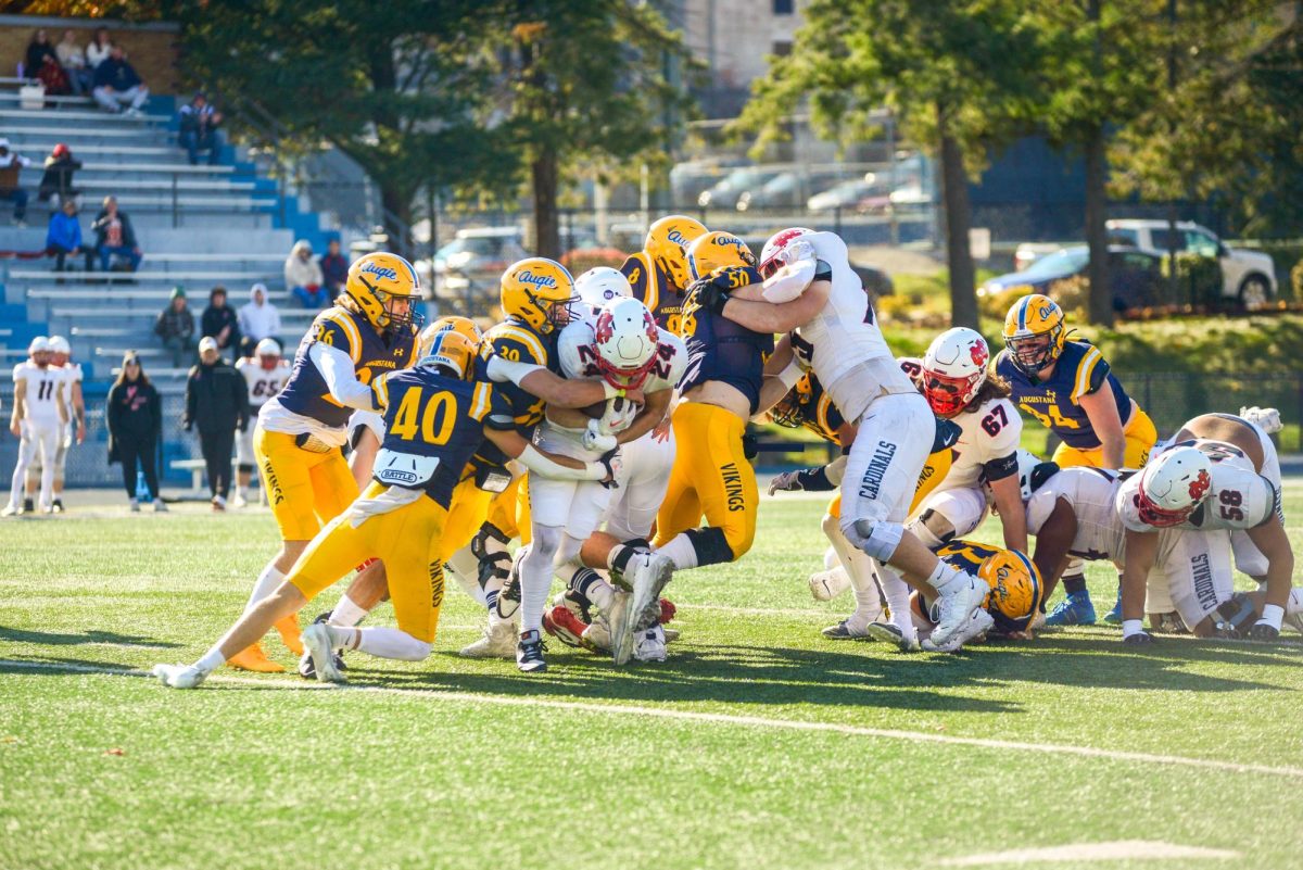 Augustana College Vikings defend the ball in an attempt to shut down North Central Cardinals offense.