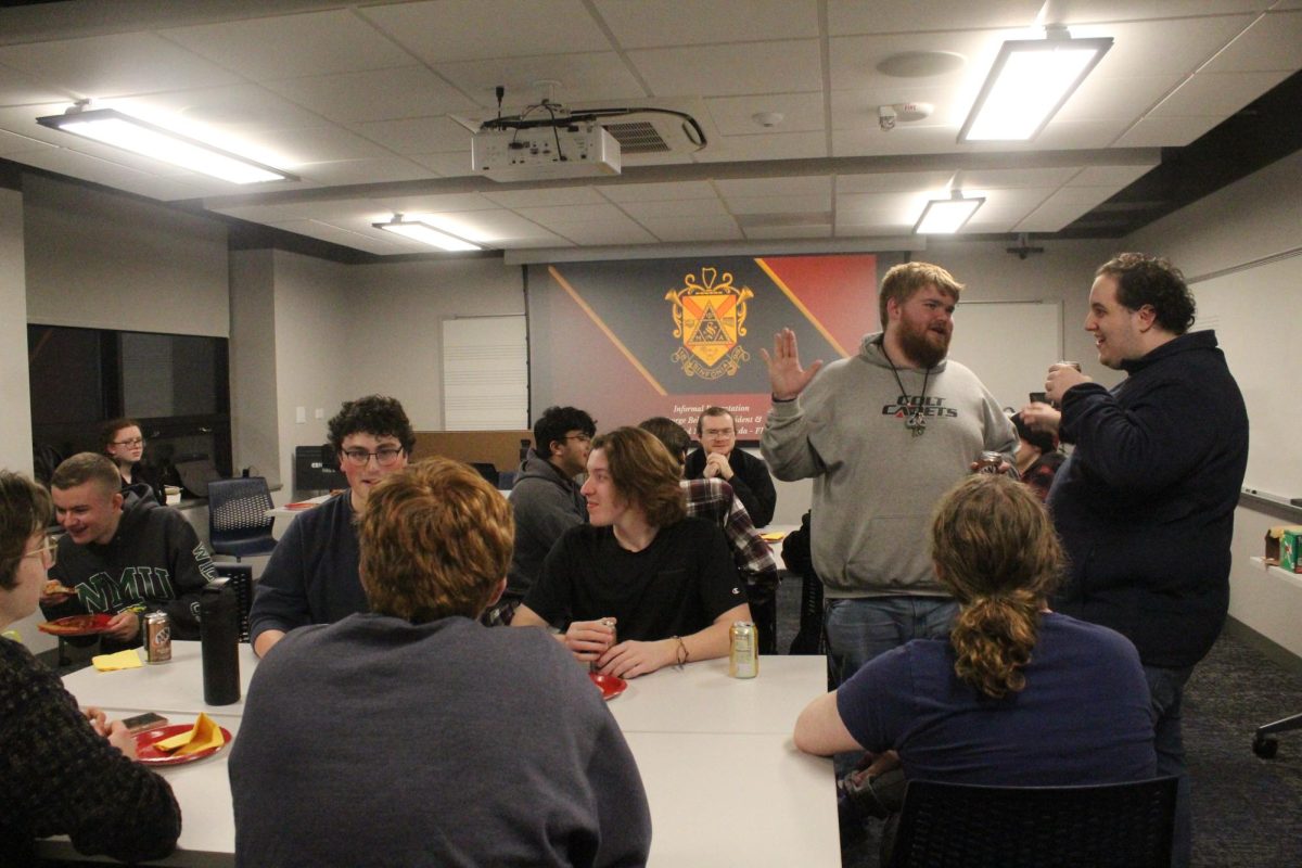Potential members socialize with each other at the Phi Mu Alpha’s Informal Recruitment event in Bergendoff on Feb. 13.