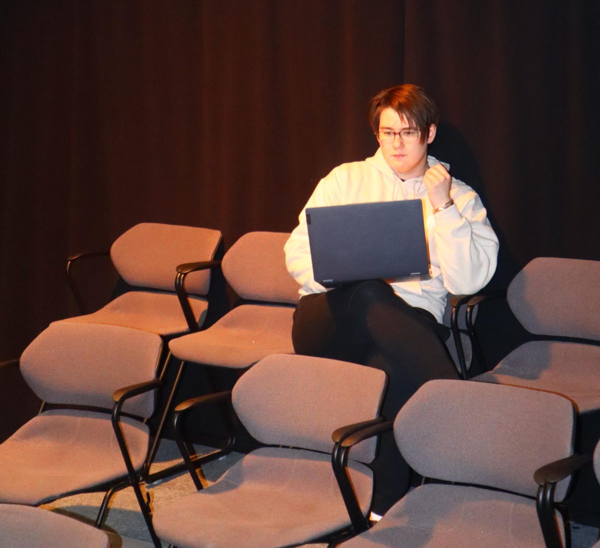 Senior Grey White, director of “Private Lives,” works on auditions in the Black Box Theatre on Feb 15.