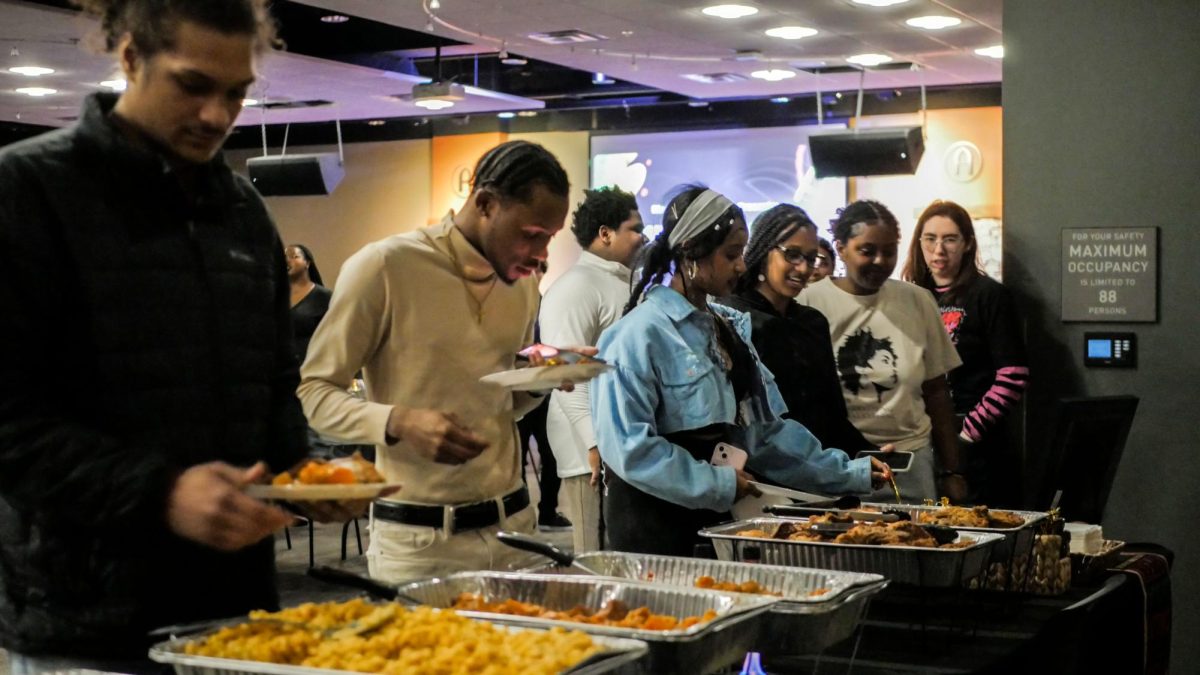 Attendees line up and help themselves to the buffet-style dinner. The majority of them respond that the food is delicious.
