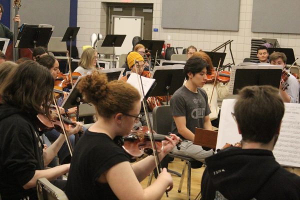 Members of a string orchestra made up of the string sections of the Augustana Symphony
Orchestra practice in Bergendoff Hall.