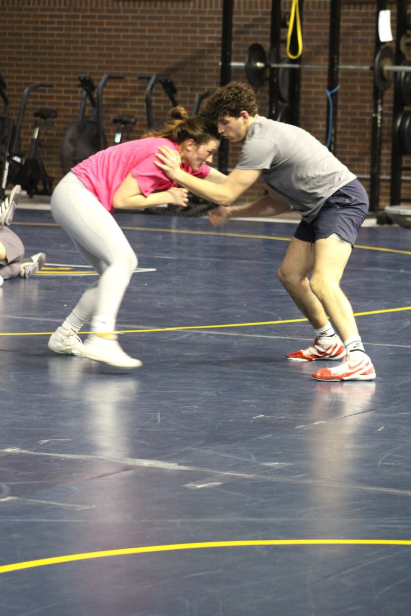 Junior Sawyer Graham tackles Vinny Querciagrossa during practice. Graham will be competing the 170-pound weight class in the national championships on March 8-9.