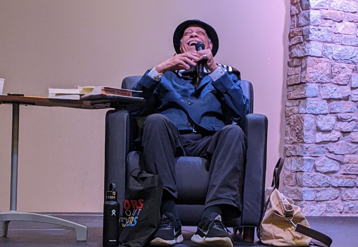 Haki Madhubuti laughing during his talk on March 5.
