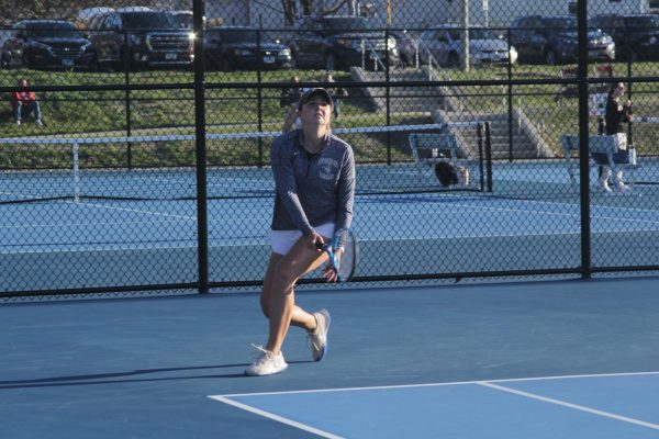 Senior Caitlyn Hanulikova performs during her singles matches against Central Dutch on Apr. 12, 2024, at Lincoln Park.