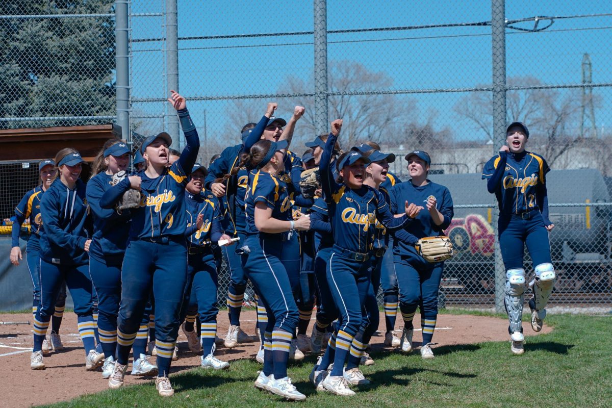 The+Augustana+College+Women%E2%80%99s+Softball+team+celebrates+their+win+on+April+6%2C+against+Milikin+University.+This+victory+was+the+first+for+Augustana+over+Millikin+in+five+years%2C+while+they+unfortunately+lost+in+game+two.