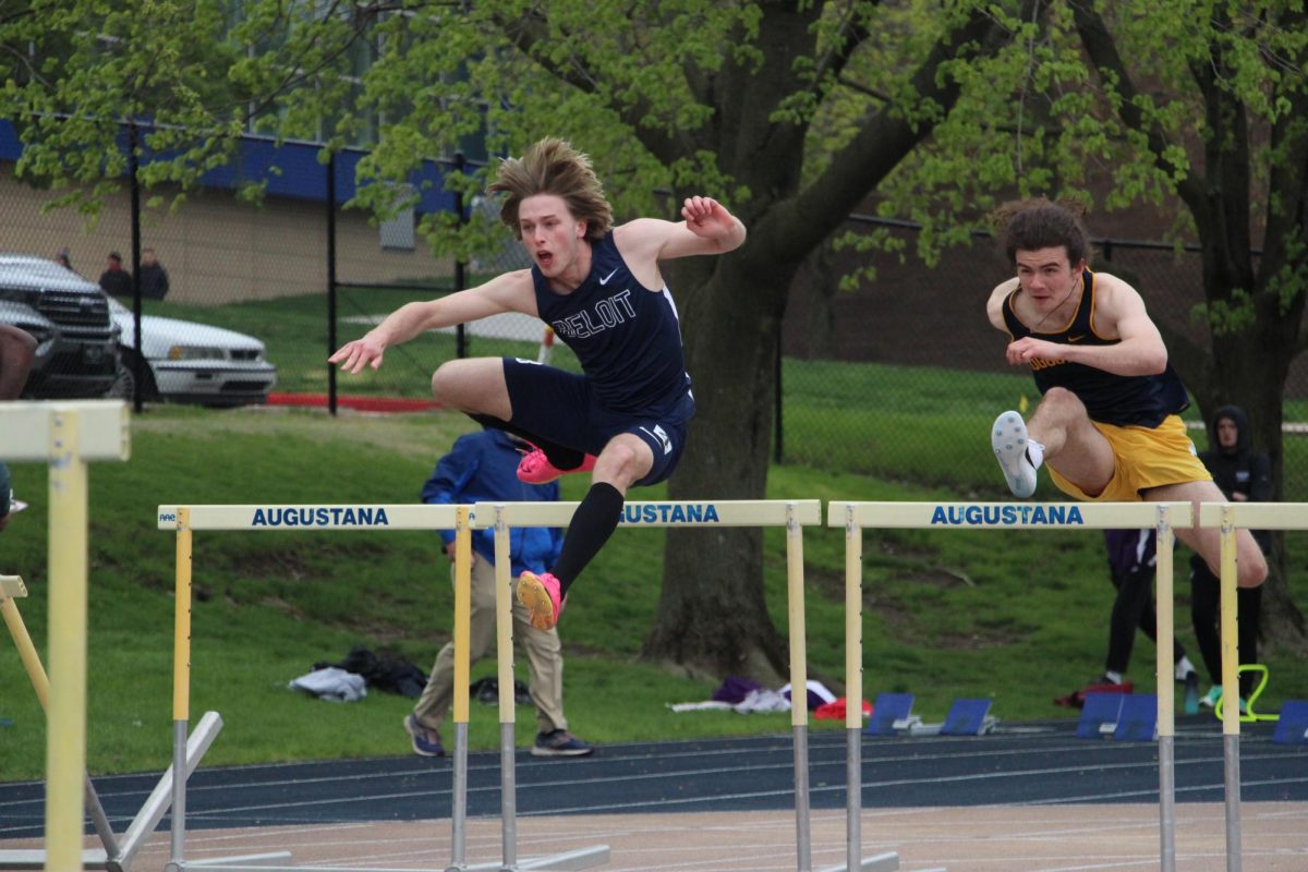 Curtis Baldwin of Augustana College and Nathaniel Otis of Beloit University leaps over hurdles in the Men’s 110 Meter Hurdles at the Knowlton Outdoor Athletic Complex, April 20.