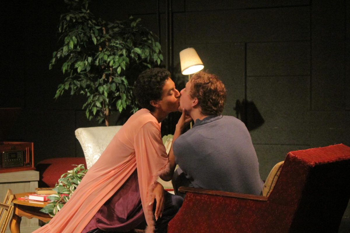 First-Year DJ Roberts, as Emmanuel Prynne, and Sophomore Noah Johnso, as Elyot Chase, kiss during the run for the comedy Private Lives in the Bruner Black Box on April 24, 2024.