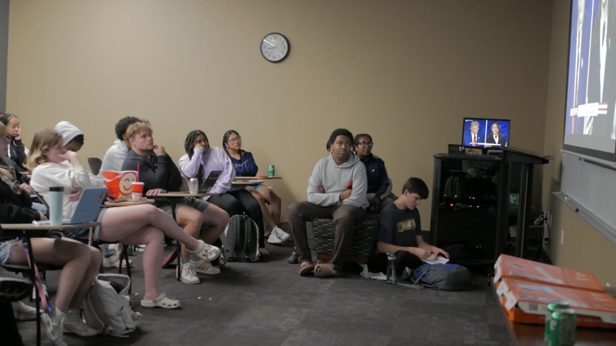 Students watch the Trump-Harris debate in Old Main 132 on Tuesday, Sept. 10, 2024.